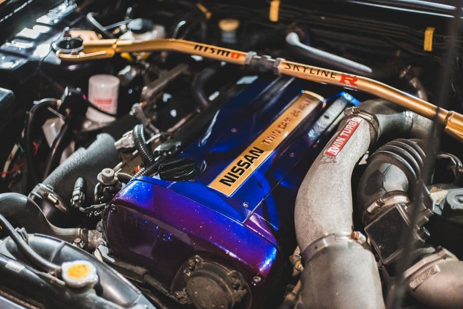 Open hood with engine bay fluid check during a scheduled maintenance service