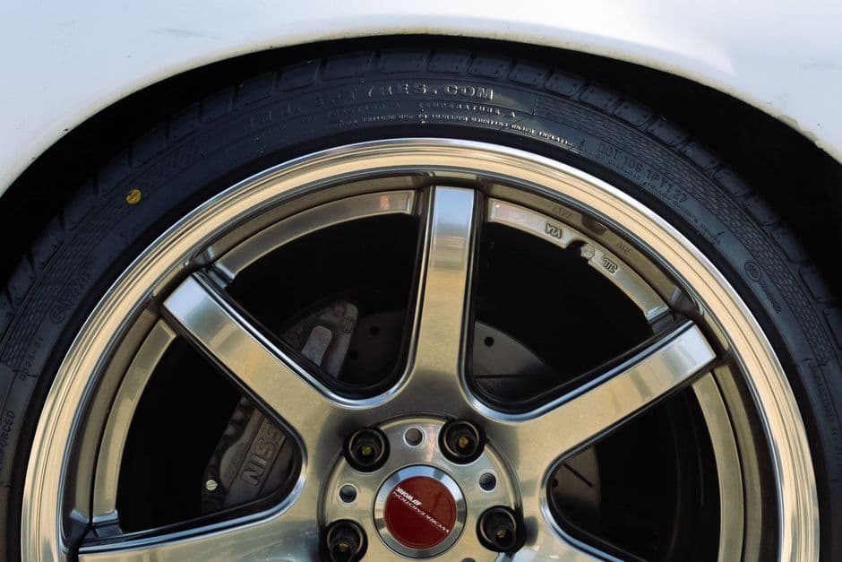 A lowered car on upgraded wheels after a suspension and wheel modification