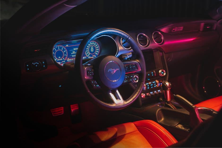 Car interior dashboard with ambient LED lighting installed along the trim