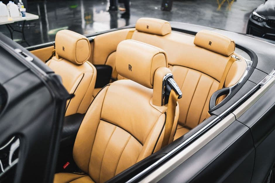 Close-up of upgraded car seat upholstery showing custom stitching detail