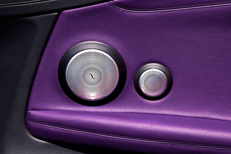 Upgraded car door speaker installed in a vehicle interior panel