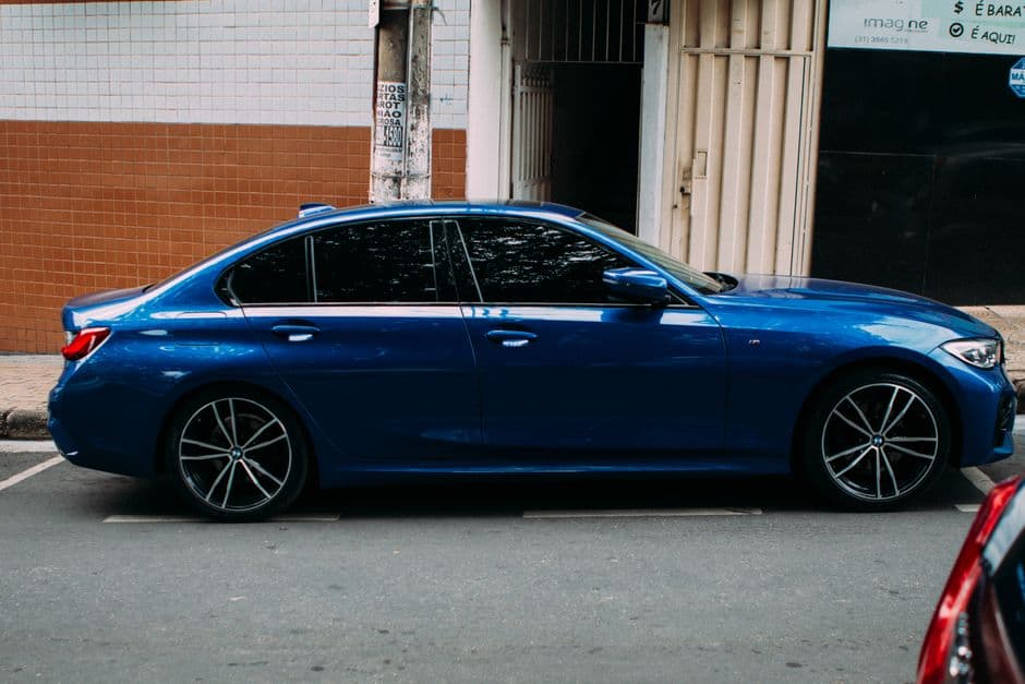 Car with tinted windows parked in direct sunlight