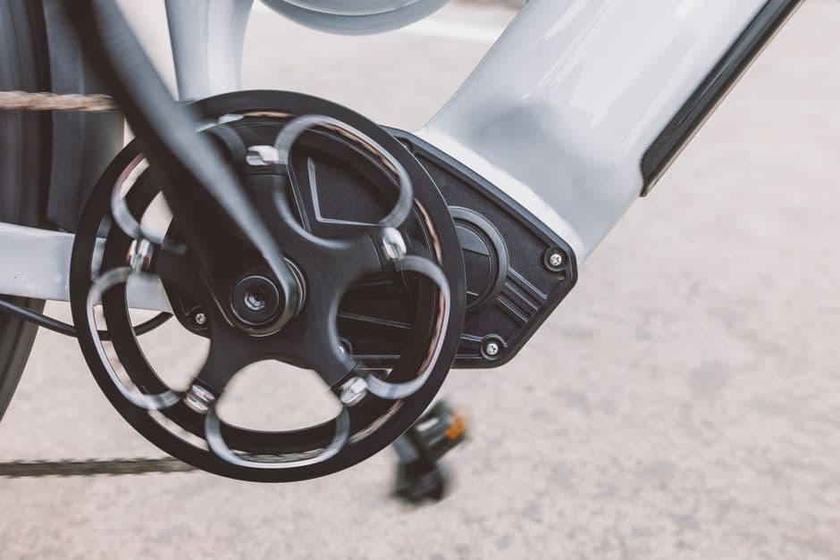 Close-up of an e-bike drivetrain and gear mechanism during a maintenance check