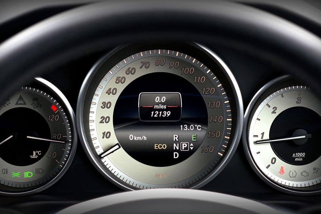 Car dashboard and odometer, where Honda's Maintenance Minder shows oil life and service codes