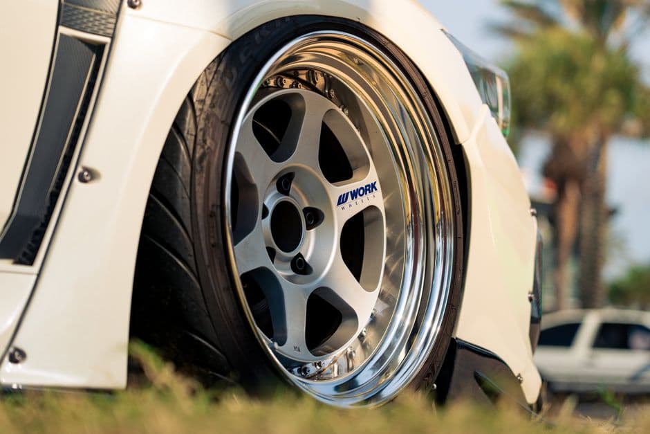 Close-up of an aftermarket chrome alloy wheel and rim after a car wheel upgrade