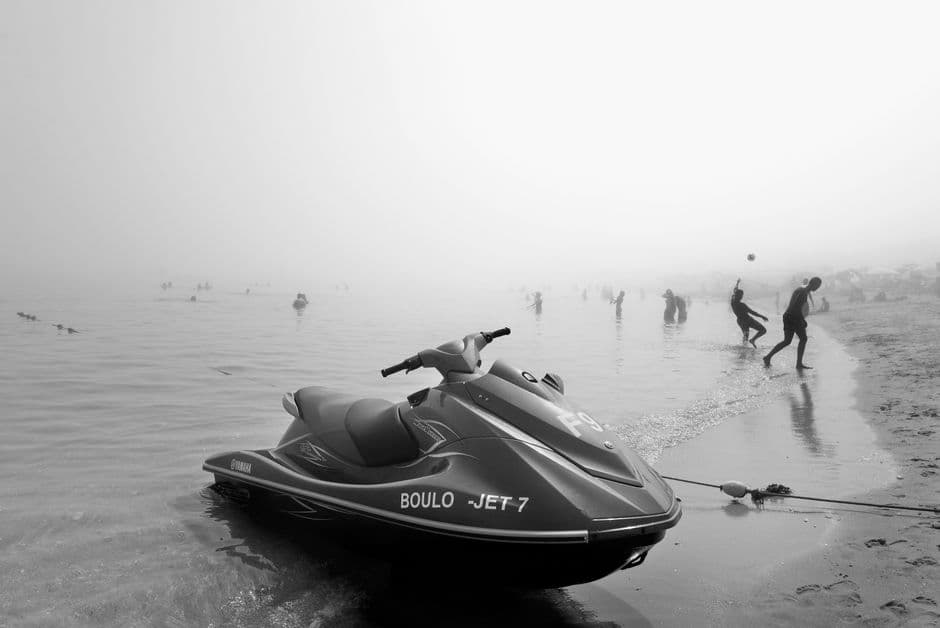 Jet ski pulled up on a shoreline, out of the water for inspection