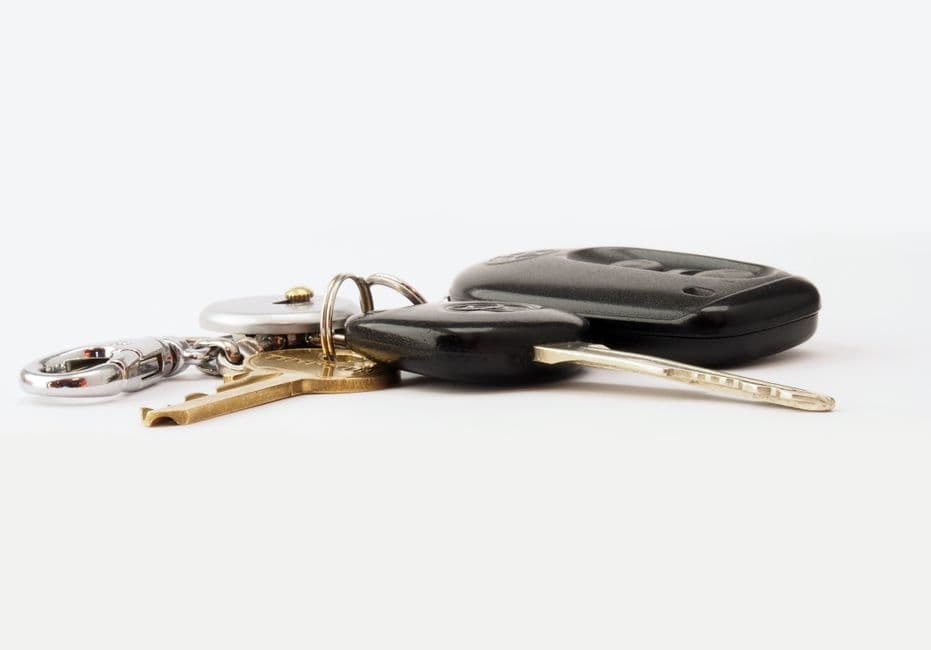 Car key fob remote resting on a surface, the kind of device keyless entry maintenance covers