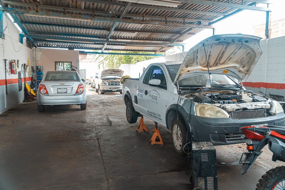 Open pickup truck engine bay during a maintenance check