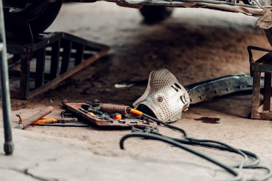 Automotive workshop tools and parts laid out, the kind of build session a project car build log template is made to capture