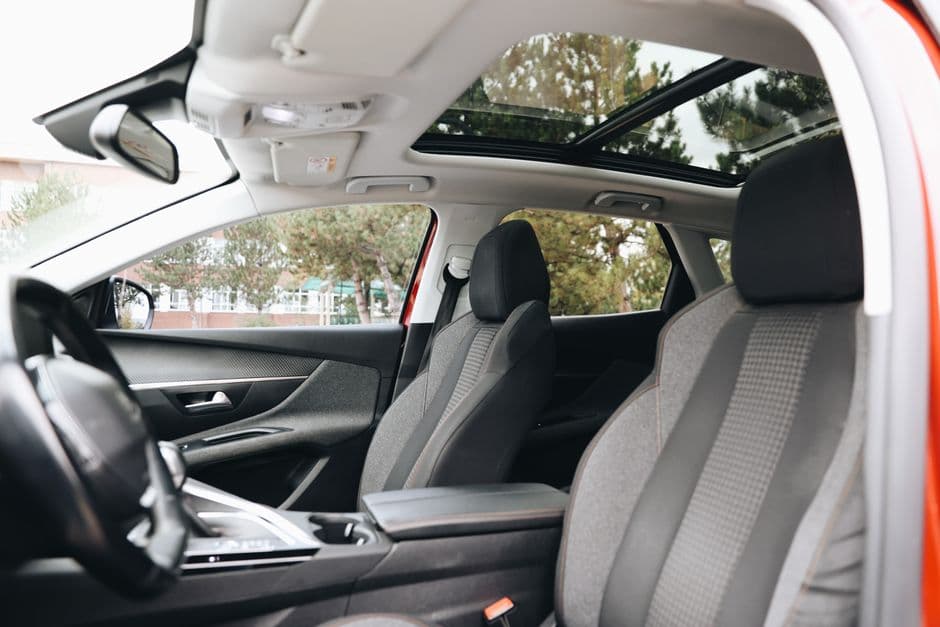 Car interior with a panoramic sunroof, the kind of feature that needs regular drain tube maintenance to avoid leaks