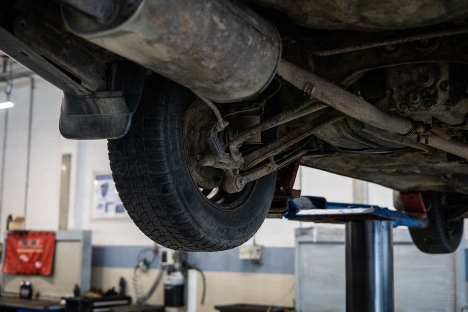 Car raised on a lift for a wheel alignment check after a suspension upgrade