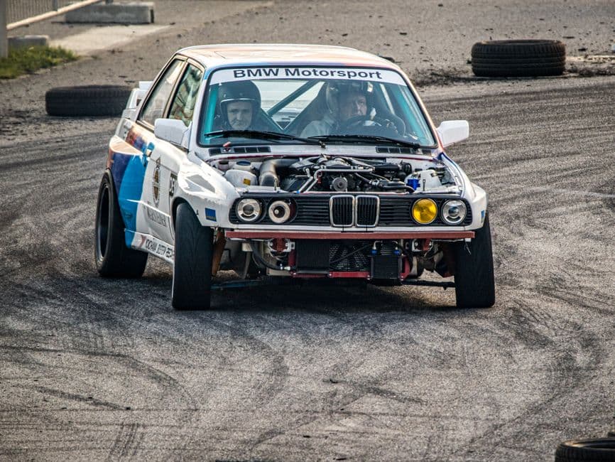Modified performance car on a race track during a track day event