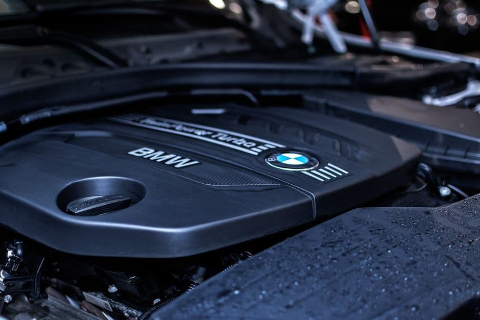 Close-up of a turbocharged BMW engine bay, the kind of setup forced induction maintenance is built around